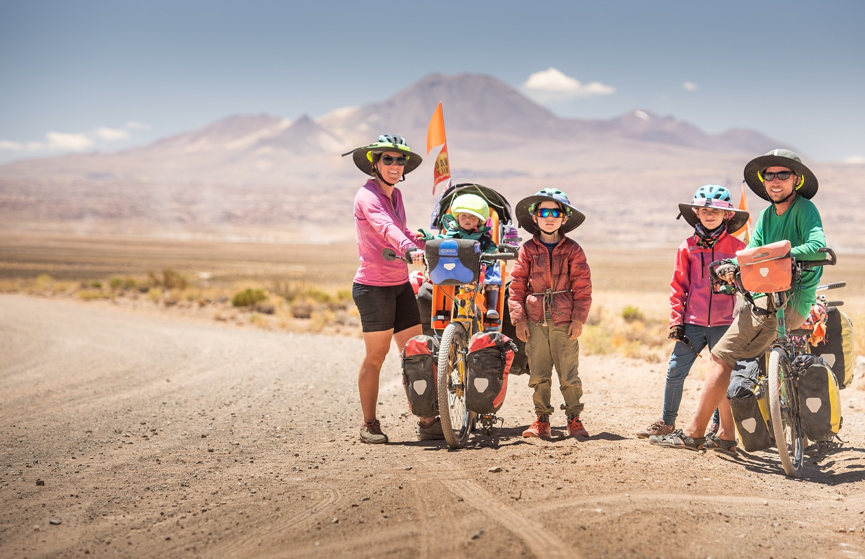 Cyclists wearing helmet brims for sun protection in Australia
